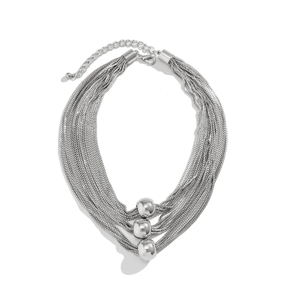 Nocturne draperat halsband med bollar