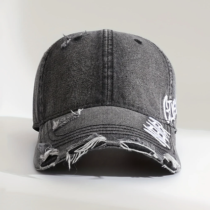 Sliten denimkeps i baseballstil med broderi Never Give Up