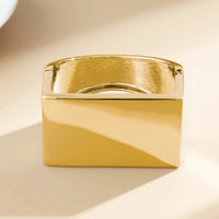Guldfärgat kubformad armband