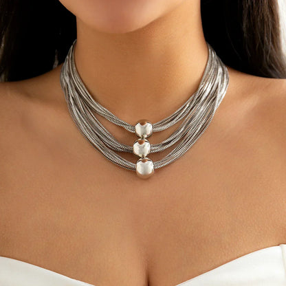 Nocturne draperat halsband med bollar
