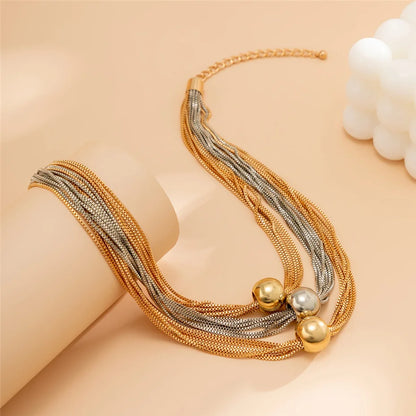 Nocturne draperat halsband med bollar