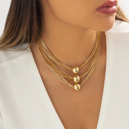 Nocturne draperat halsband med bollar